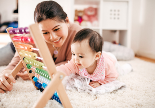 woman playing with toddler