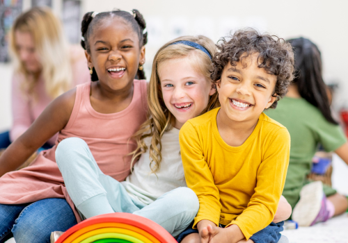 Young first day Kindergarteners happy for their transition from preschool