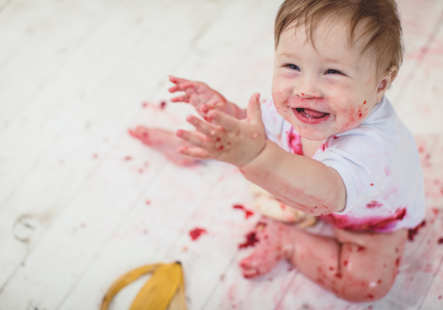 Baby eating berries