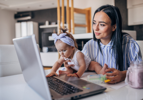 parent on the computer with baby