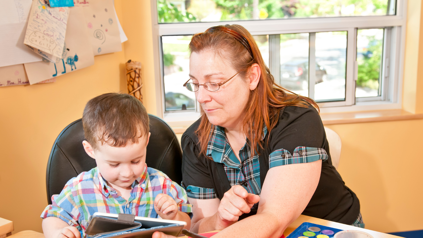 child care worker working with child 