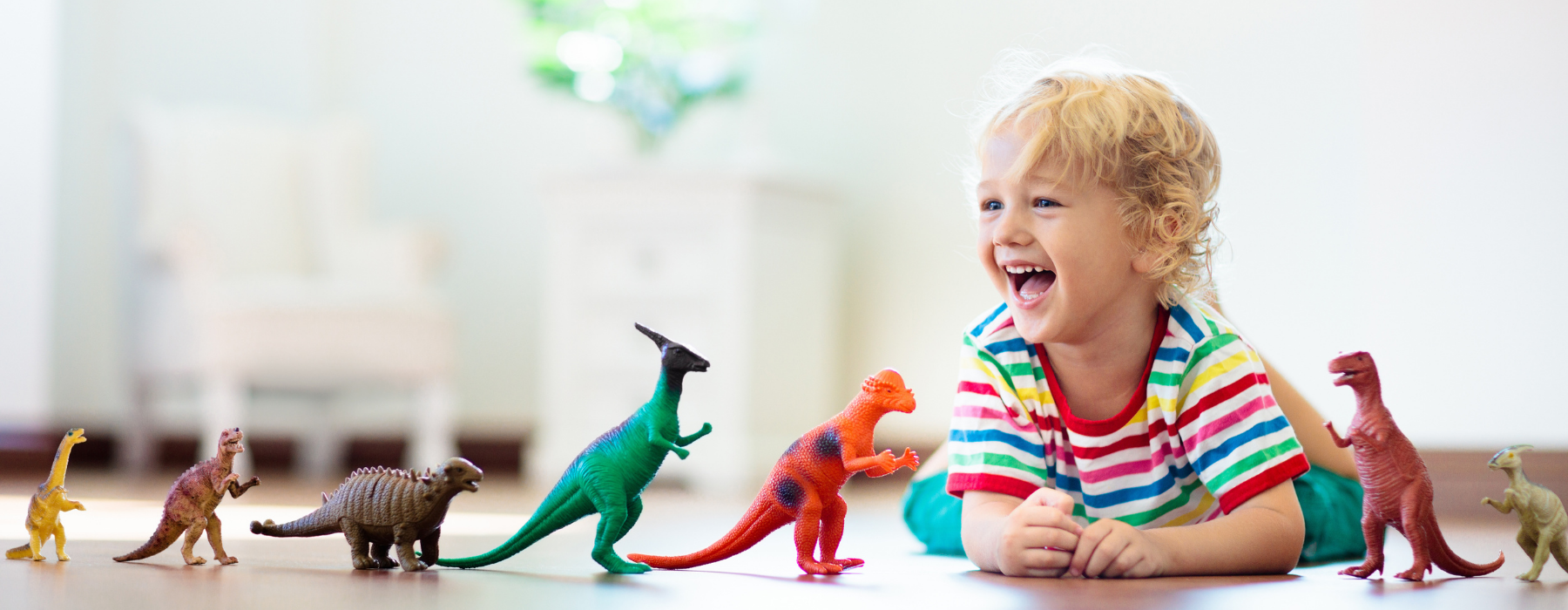 Child playing with dinosaurs