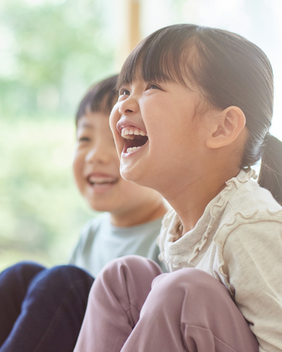 Young children laughing together