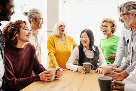 group sitting at a table having a conversation