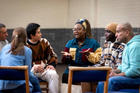 group sitting at a table having a conversation