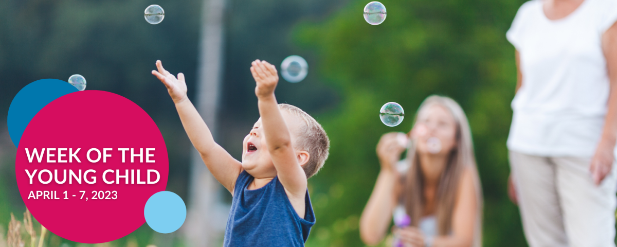 child chasing bubbles